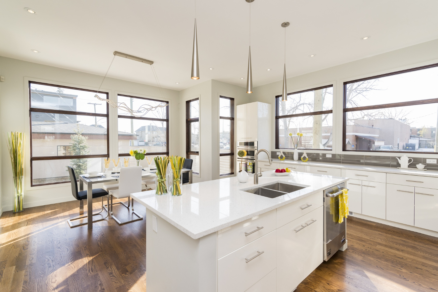 Modern kitchen remodel with white cabinets and marble countertops